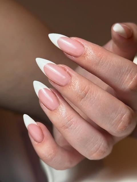 Long almond nails, soft pink with crisp white French tips