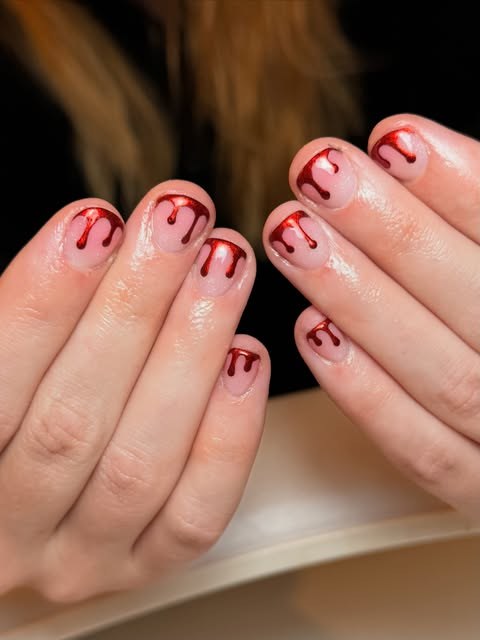 Short sheer pink BIAB with red chrome drips for Halloween